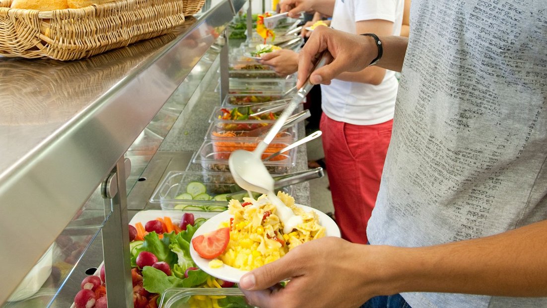 Students put their lunch menu together at the counter.
