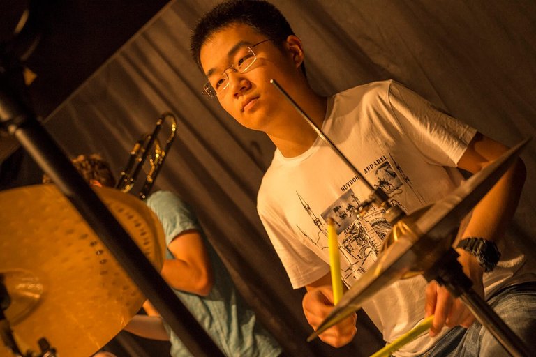 Students playing the drums