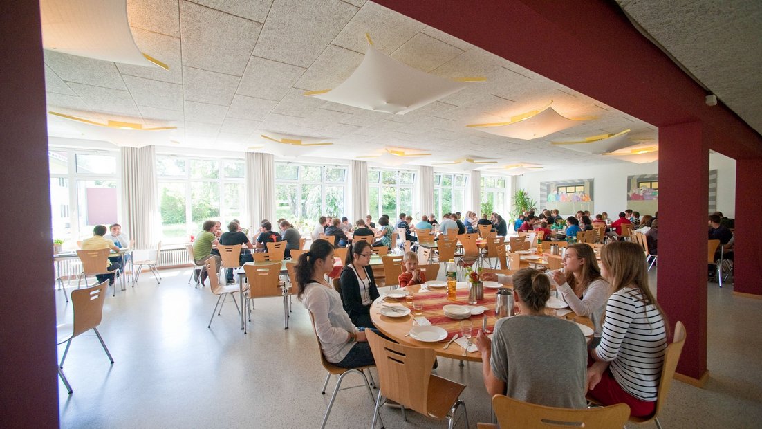 Students eating together in the dining room