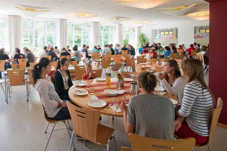 Students eating together in the dining room