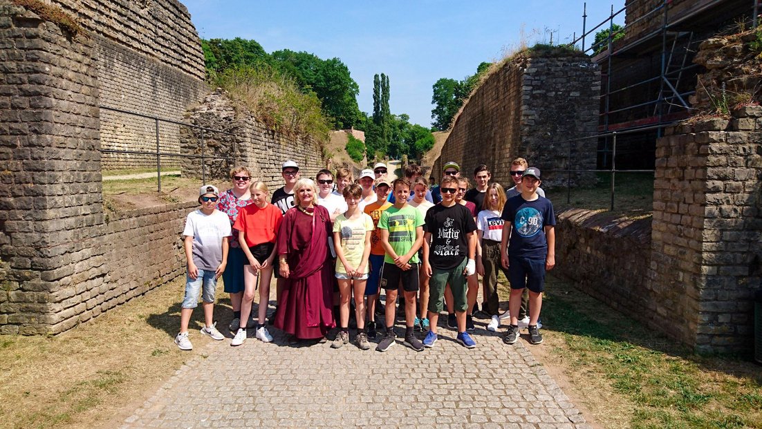 One class stands between historic walls during a school trip to Trier.