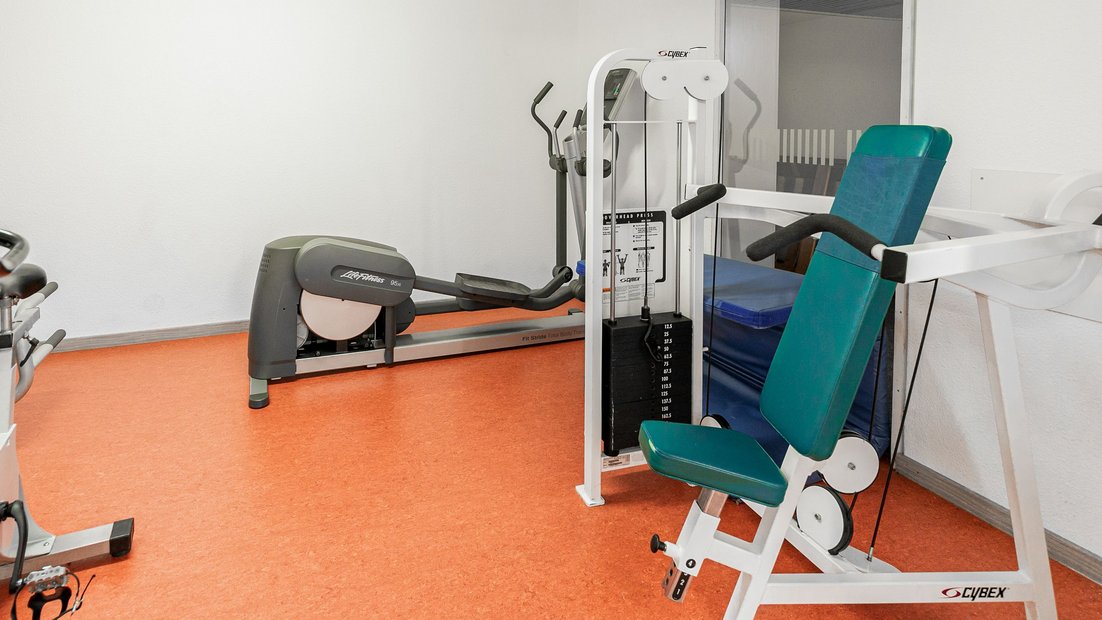 Fitness studio with weight bench and cross trainer