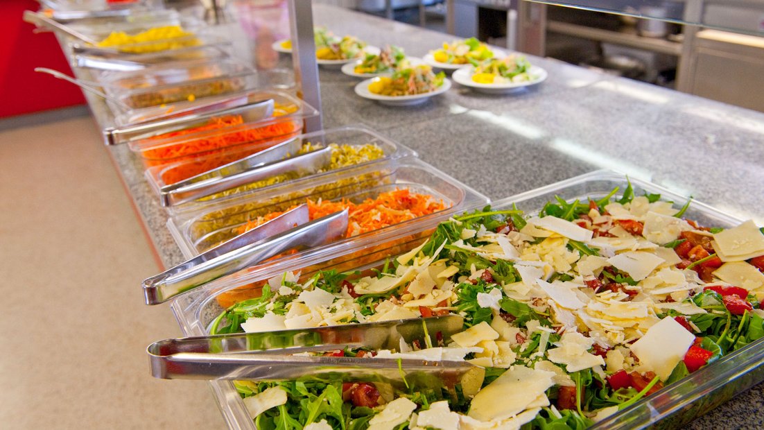 Appetizingly arranged salads on a counter